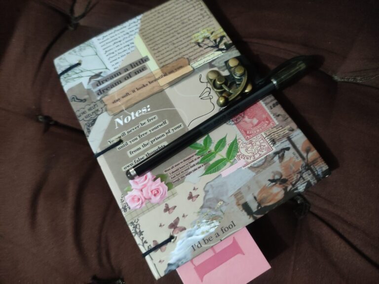 Handwritten plant journal with notes and pen used to track plant growth, pest issues, and seasonal changes in a terrace container garden